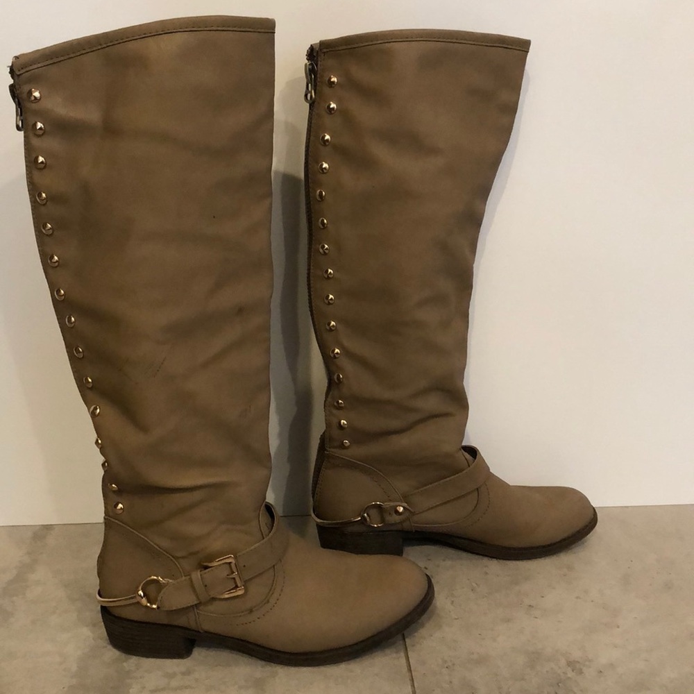 Tall brown buckled boots